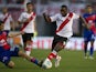 River Plate's defender Eder Alvarez Balanta vies for the ball with Tigre's midfielder Joaquin Arzura during their Argentine First Division football match, at the Monumental stadium in Buenos Aires, Argentina, on September 8, 2013