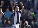 Real Valladolid's Fausto Rossi celebrates after scoring the opening goal against Barcelona during their La Liga match on March 8, 2014