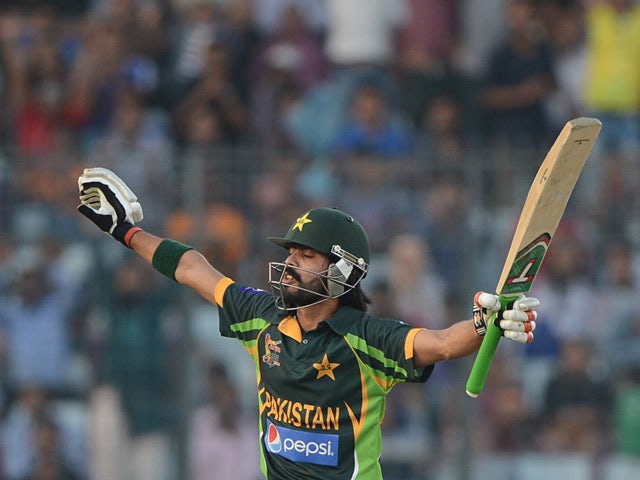 Pakistan's Fawad Alam celebrates after scoring a century (100 runs) during the final match of the Asia Cup one-day cricket tournament against Sri Lanka on March 8, 2014