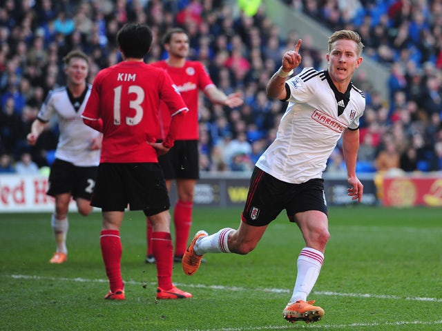 Lewis Holtby of Fulham celebrates after scoring the first Fulham goal during the Barclays Premier league match between Cardiff City and Fulham at Cardiff City Stadium on March 8, 2014