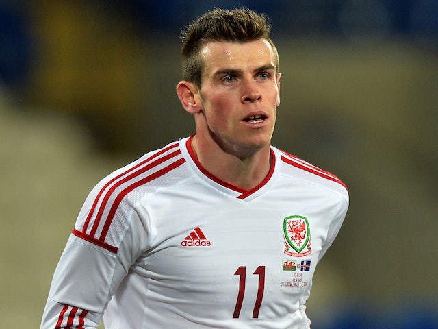 Wales' Gareth Bale celebrates scoring their third goal during the international friendly football match between Wales and Iceland at Cardiff City Stadium in Cardiff, south Wales, on March 5, 2014