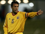 Gheorghe Popescu of Romania protests his innocence during the 2004 European Championship Group 2 Qualifying match between Luxembourg and Romania on October 16, 2002 