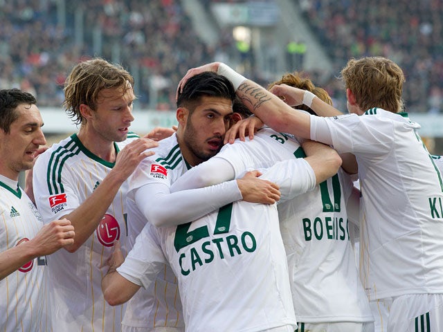 Bayer Leverkusen's Gonzalo Castro is congratulated by teammates after scoring the opening goal against Hannover during their Bundesliga match on March 8, 2014