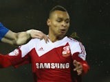 Jacob Murphy (R) of Swindon Town is challenged by Craig Alcock (L) of Peterborough United during the Johnstone's Paint Southern Area Final Second Leg match on February 17, 2014