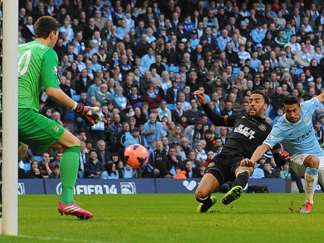 Wigan's James Perch scores his team's second goal against Manchester City during their FA Cup quarter-final match on March 9, 2014