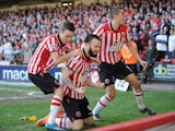 Sheffield United's John Brayford celebrates with teammates after scoring his team's second goal against Charlton during their FA Cup quarter-final match on March 9, 2014