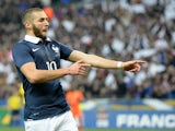 France's forward Karim Benzema celebrates after scoring the first goal during a friendly football match between France and Netherlands at the Stade de France in Saint-Denis near Paris on March 5, 2014