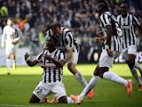 Juventus' Kwadwo Asamoah celebrates with teammates after scoring the opening goal against Fiorentina during their Serie A match on March 9, 2014