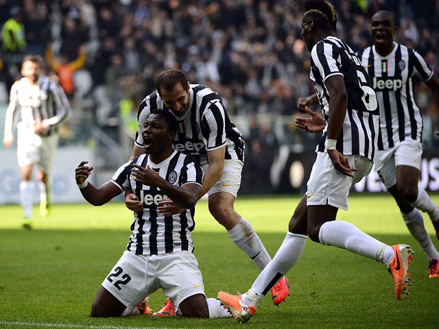 Juventus' Kwadwo Asamoah celebrates with teammates after scoring the opening goal against Fiorentina during their Serie A match on March 9, 2014