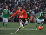 Lorient's French forward Jeremie Aliadiere shoots and scores a penalty shot during the French L1 football match Lorient vs Saint-Etienne on March 9, 2014