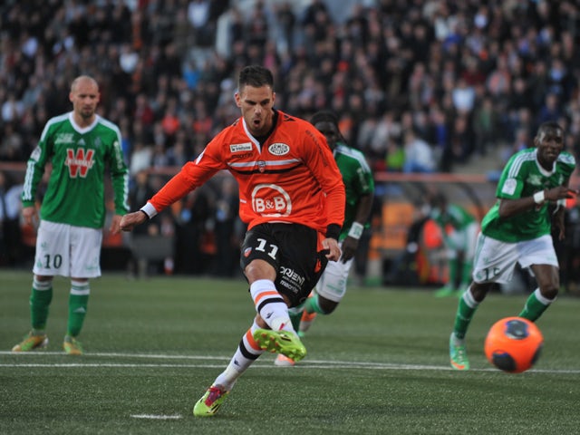 Lorient's French forward Jeremie Aliadiere shoots and scores a penalty shot during the French L1 football match Lorient vs Saint-Etienne on March 9, 2014