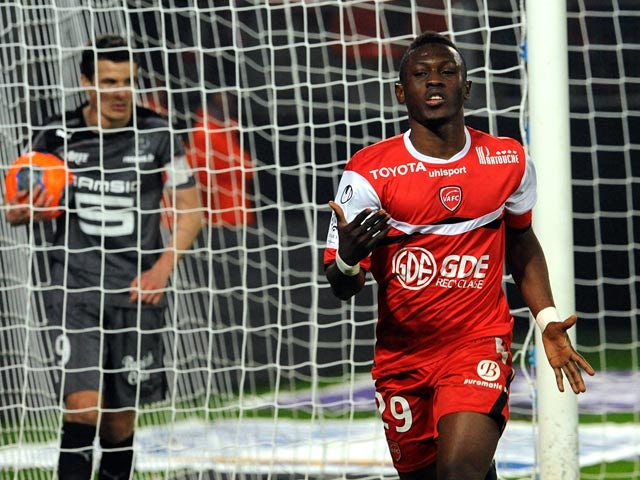 Valenciennes's Majeed Waris celebrates after scoring his team's second goal against Rennes during their Ligue 1 match on March 8, 2014
