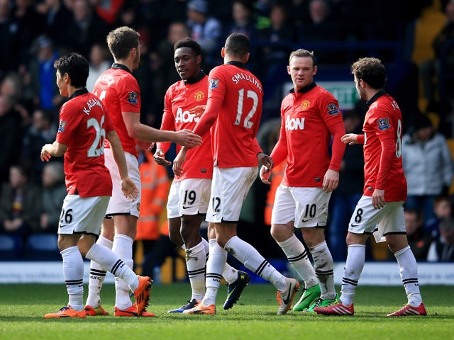 Danny Welbeck of Manchester United celebrates with team mates as he scores their third goal during the Barclays Premier League match between West Bromwich Albion and Manchester United at The Hawthorns on March 8, 2014