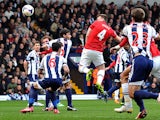 Manchester United's English defender Phil Jones heads the ball to score his team's first goal during the English Premier League football match between West Bromwich Albion and Manchester United at The Hawthorns in West Bromwich, central England, on March 