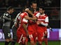 Valenciennes's Matthieu Dossevi celebrates with teammates after scoring his team's first goal against Rennes during their Ligue 1 match on March 8, 2014