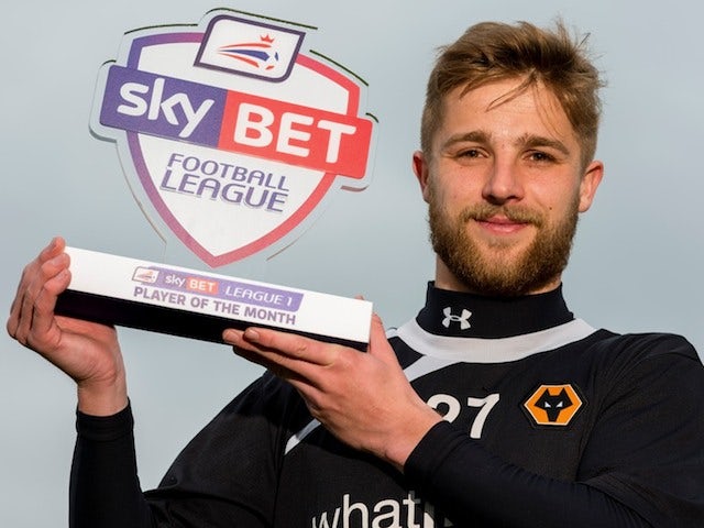 Wolves' Michael Jacobs with his February Player of the Month award on March 6, 2014