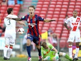 Adam Taggart of the Jets celebrates a goal with Heart players looking dejected during the round 22 A-League match between the Newcastle Jets and Melbourne Heart at Hunter Stadium on March 8, 2014