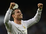 Real Madrid's Portuguese forward Cristiano Ronaldo celebrates after scoring their first goal during the Spanish league football match Real Madrid CF vs Levante UD at the Santiago Bernabeu stadium in Madrid on March 9, 2014