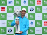 Ross Fisher of England poses with the trophy after winning the Tshwane Open on a score of -20 under par at Copperleaf Golf & Country Estate on March 2, 2014