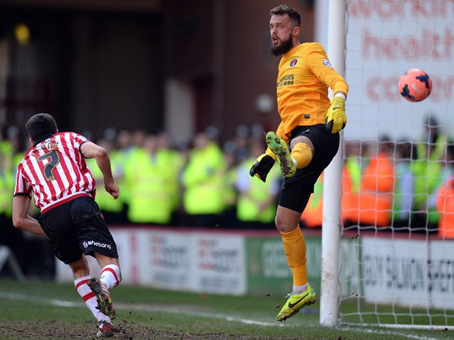 Sheffield United's Ryan Flynn scores his team's opening goal against Charlton during their FA Cup quarter-final match on March 9, 2014