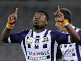Toulouse's Serge Aurier celebrates after scoring his team's first goal against Reims during their Ligue 1 match on March 8, 2014