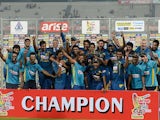 Sri Lanka cricketers celebrate with the trophy after winning the final match of the Asia Cup one-day cricket tournament against Pakistan on March 8, 2014