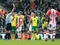 Jonathan Walters of Stoke is shown the red card by referee Andre Marriner following his challenge on Alexander Tettey #27 of Norwich during the Barclays Premier League match between Norwich and Stoke at Carrow Road on March 8, 2014