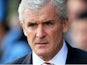 Mark Hughes the Stoke manager looks on during the Barclays Premier League match between Norwich and Stoke at Carrow Road on March 8, 2014