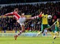 Peter Crouch of Stoke stretches in vain to reach a cross during the Barclays Premier League match between Norwich and Stoke at Carrow Road on March 8, 2014