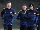 Thomas Vermaelen and Tomas Rosicky of Arsenal during a training session at London Colney on March 12, 2013