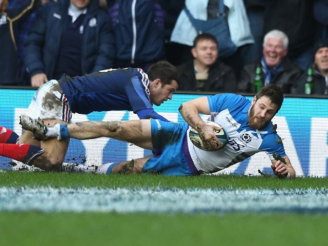 Scotland's Tommy Seymour scores the second try against France during their Six Nations International rugby union match on March 8, 2014