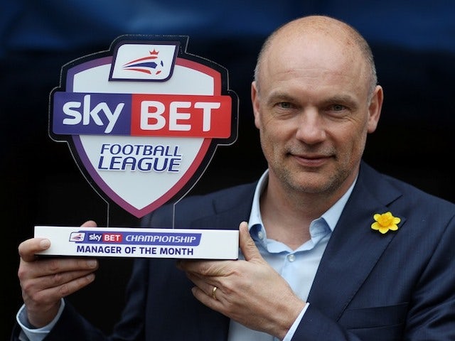 Wigan Athletic boss Uwe Rosler with his February Manager of the Month award on March 6, 2014