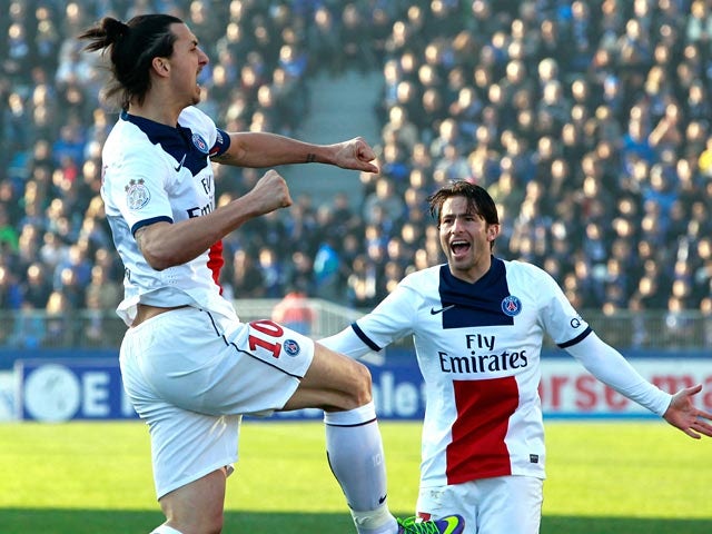 PSG's Zlatan Ibrahimovic celebrates with teammate Maxwell after scoring the opening goal against Bastia during their Ligue 1 match on March 8, 2014