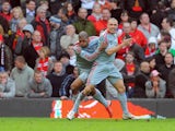 Liverpool's Andrea Dossena celebrates with teammate Ryan Babel after scoring his team's fourth goal against Manchester United during their Premier League match on March 14, 2009