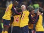 Arsenal players celebrate their win over Roma on penalties on March 11, 2009.