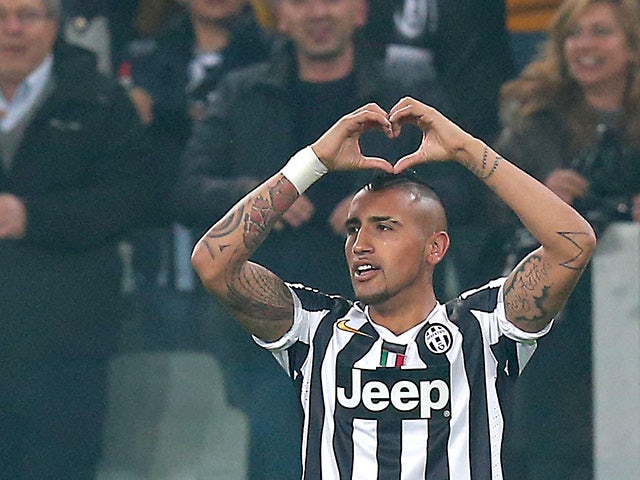 Juventus' Arturo Vidal celebrates after scoring the opening goal against Fiorentina during their Europa League match on March 13, 2014