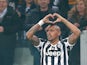 Juventus' Arturo Vidal celebrates after scoring the opening goal against Fiorentina during their Europa League match on March 13, 2014