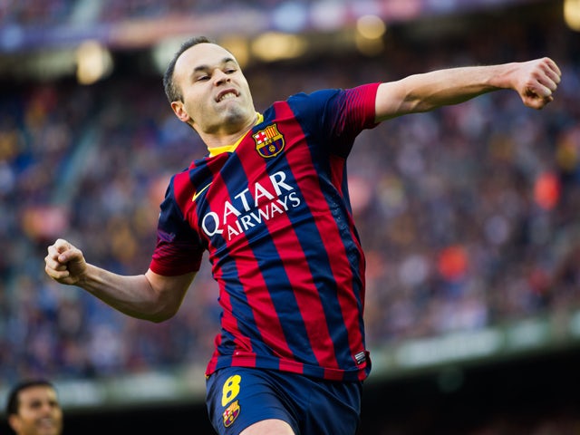 Andres Iniesta of FC Barcelona celebrates after scoring his team's third goal during the La Liga match between FC Barcelona and CA Osasuna at Camp Nou on March 16, 2014