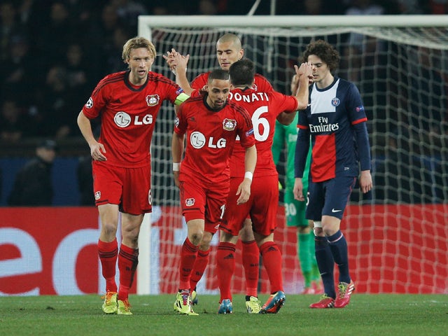 Sidney Sam of Bayer Leverkusen celebrates with team mates as he scores their first goal during the UEFA Champions League Round of 16 second leg match between Paris Saint-Germain FC and Bayer Leverkusen at Parc des Princes on March 12, 2014