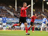 Juan Cala of Cardiff City celebrates scores his team's first goal during the Barclays Premier League match between Everton and Cardiff City at Goodison Park on March 15, 2014