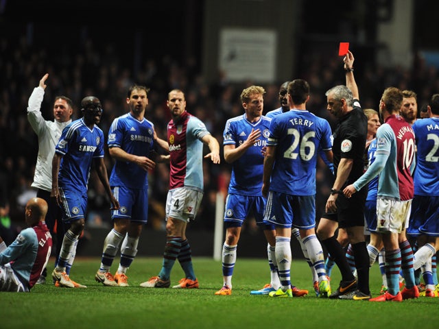 Ramires of Chelsea is shown a red card and is sent off by referee Chris Foy after a challenge on Karim El Ahmadi of Aston Villa (L) during the Barclays Premier League match between Aston Villa and Chelsea at Villa Park on March 15, 2014
