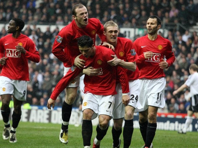 Cristiano Ronaldo and his Manchester United teammates celebrate his goal against Derby County on March 15, 2013.