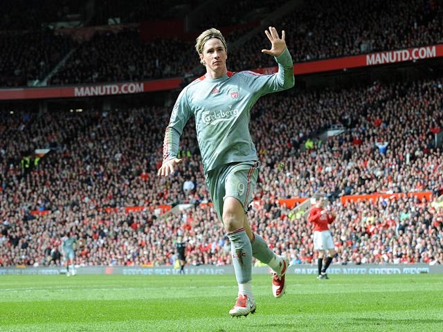 Liverpool's Fernando Torres celebrates after scoring his team's opening goal against Manchester United during their Premier League match on March 14, 2009