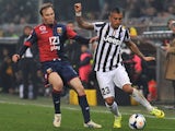 Genoa's Giovanni Marchese and Juventus' Arturo Vidal in action during the Serie A match on March 16, 2014