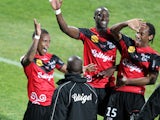 Guingamp's French midfielder Claudio Beauvue celebrates with teammates after scoring during the French L1 football match Ajaccio (ACA) vs Guingamp (EAG) at the Francois Coty stadium in Ajaccio, Corsica island, on March 15, 2014