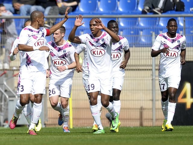 Bordeaux's Henrique celebrates with teammates after scoring against Montpellier in the Ligue 1 match on March 16, 2014