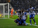 Porto's Jackson Martinez celebrates with teammates after scoring the opening goal against Napoli during their Europa League match on March 13, 2014