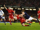 Wales' Jamie Roberts scores a try against Scotland during the Six Nations match on March 15, 2014
