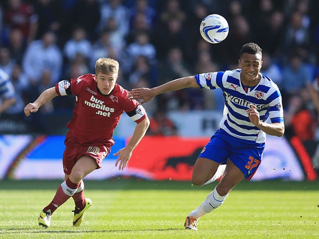 Derby's Jamie Ward and Reading's Jordan Obita in action during their Championship match on March 15, 2014