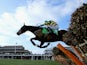 Barry Geraghty on Jezki jumps the last on his way to victory in The Stan James Champion Hurdle Challenge Trophy during The Festival Champion Day at Cheltenham Racecourse on March 11, 2014
